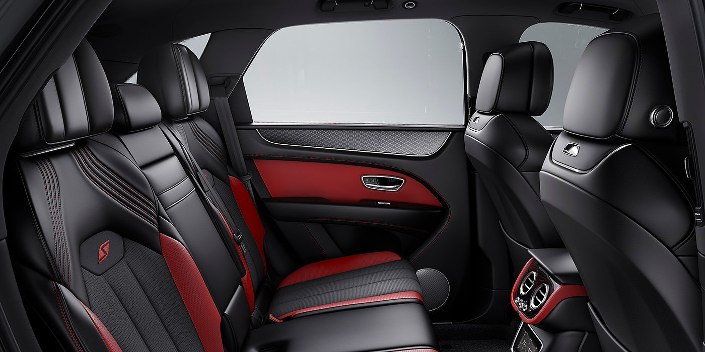 Bentley Fuzhou Bentey Bentayga S interior view for rear passengers with Beluga black and Hotspur red coloured hide.
