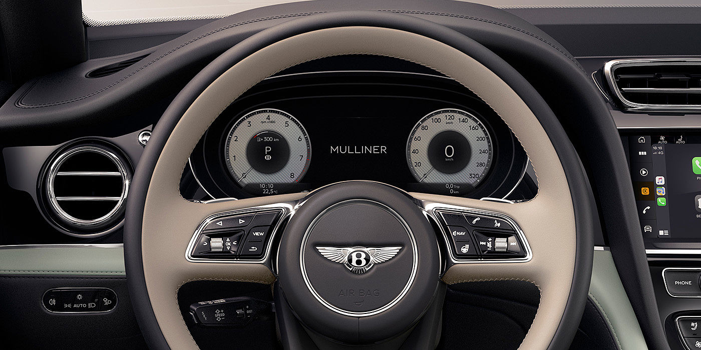 Bentayga Extended Wheel Base Mulliner steering wheel interior shot with multimedia interface display.